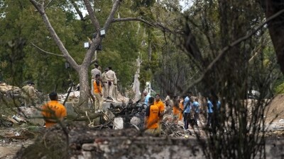 SDRF and police personnel at the site of the Air India plane crash, in Ahmedabad on June 13, 2025. (PTI) SDRF and police personnel at the site of the Air India plane crash, in Ahmedabad on June 13, 2025. (PTI)