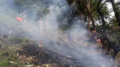 Security personnel at the spot after a helicopter crashed near the Kedarnath shrine, in Rudraprayag district, Uttarakhand on Sunday. (PTI)