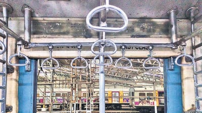 The additional grab handles, which will anchor commuters on the footboards, will be fixed to horizontal rods attached to the ceiling of the coaches, just inside the doors. (HT PHOTO) The additional grab handles, which will anchor commuters on the footboards, will be fixed to horizontal rods attached to the ceiling of the coaches, just inside the doors. (HT PHOTO)