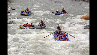 Tourists participate in rafting in the Beas river, near Manali, in Kullu district Himachal Pradesh on Monday. (PTI)