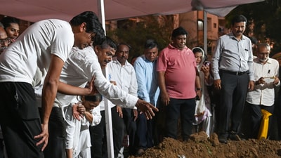 Family members and friends laid to rest the coffins of Rozar David Christian and his wife, Rachnaben Rozar Christian, both victims of the Air India plane crash, at a cemetery in Ahmedabad. June 15 (Raju Shinde/HT Photo) Family members and friends laid to rest the coffins of Rozar David Christian and his wife, Rachnaben Rozar Christian, both victims of the Air India plane crash, at a cemetery in Ahmedabad. June 15 (Raju Shinde/HT Photo)