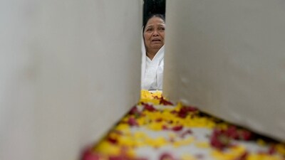 A relative mourns during a special prayer organised for the victims killed in the Air India flight crash before the funeral ceremony in Ahmedabad on June 15 (AFP) A relative mourns during a special prayer organised for the victims killed in the Air India flight crash before the funeral ceremony in Ahmedabad on June 15 (AFP)