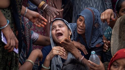 Dabu Patni, mourns as she waits for the body of her younger brother Akash Patni, 14, who died after an Air India Boeing 787-8 Dreamliner plane crashed during take-off from an airport, to arrive at his house for the last rites in Ahmedabad, June 15 (REUTERS)