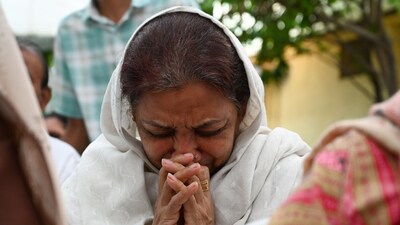 Family members and friends gathered for the last rites of Rozar David Christian and his wife, Rachnaben Rozar Christian, both victims of the Air India plane crash in Ahmedabad on Sunday. Ahmedabad. June 15 (Raju Shinde/HT Photo) Family members and friends gathered for the last rites of Rozar David Christian and his wife, Rachnaben Rozar Christian, both victims of the Air India plane crash in Ahmedabad on Sunday. Ahmedabad. June 15 (Raju Shinde/HT Photo)