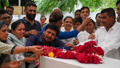Family members and friends gathered for the last rites of Rozar David Christian and his wife, Rachnaben Rozar Christian, both victims of the Air India plane crash in Ahmedabad on Sunday. Ahmedabad (Raju Shinde/HT Photo) Family members and friends gathered for the last rites of Rozar David Christian and his wife, Rachnaben Rozar Christian, both victims of the Air India plane crash in Ahmedabad on Sunday. Ahmedabad (Raju Shinde/HT Photo)