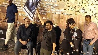 Director Maruthi holds up a poster of Prabhas during The RajaSaab teaser launch. Director Maruthi holds up a poster of Prabhas during The RajaSaab teaser launch.