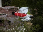 A tail of an Air India Boeing 787 Dreamliner plane that crashed is seen stuck on a building after the incident in Ahmedabad, India, June 12, 2025.