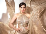 Raveena Tandon shimmers in a golden halter-neck dress with a long train from Suneet Varma. Her look is further spruced up by diamond earrings from Shailja’s Fine Jewellery(Photo: Deepak Das)