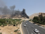 Smoke rises following what Iran says was an Israeli attack on Sharan Oil depot in Tehran.