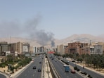 Smoke rises following what Iran says was an Israeli attack on Sharan Oil depot in Tehran.