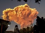 Villagers watch the eruption of Mount Lewotobi Laki-Laki as seen from Talibura village in Sikka, East Nusa Tenggara, on June 17 Villagers watch the eruption of Mount Lewotobi Laki-Laki as seen from Talibura village in Sikka, East Nusa Tenggara, on June 17