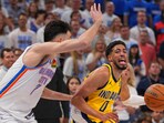 Indiana Pacers guard Tyrese Haliburton (0) drives past Oklahoma City Thunder forward Chet Holmgren (7) during the second half of Game 5 of the NBA Finals basketball series.