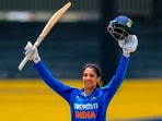 India's batter Smriti Mandhana celebrates her century during the 2025 Sri Lanka Women's Tri-Nation Series final cricket match against Sri Lanka