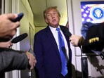 U.S. President Donald Trump speaks to reporters aboard Air Force One after departing early from the G7 summit in Canada to return to Washington, on June 17, 2025.