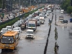 Vehicles wade through a waterlogged stretch after heavy rain on the National Highway-48 service road near Narsinghpur village, in Gurugram Vehicles wade through a waterlogged stretch after heavy rain on the National Highway-48 service road near Narsinghpur village, in Gurugram