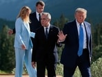 Japanese Prime Minister Shigeru Ishiba, Italian Prime Minister Giorgia Meloni, French President Emmanuel Macron, Canadian Prime Minister Mark Carney, and U.S. President Donald Trump depart following a group photo in front of the Canadian Rockies at the Kananaskis Country Golf Course during the G7 Leaders' Summit on June 16, 2025 in Kananaskis, Alberta. 