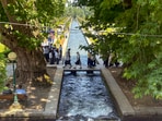 People visited Verinag Mughal Garden after it was reopened, in Jammu and Kashmir on Tuesday.