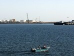 A speed boat passes by oil docks at the port of Kalantari in the city of Chabahar, east of the Strait of Hormuz. 