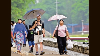 A family enjoying the rainy weather at Sukhna Lake in Chandigarh on Tuesday. (Ravi Kumar/HT) A family enjoying the rainy weather at Sukhna Lake in Chandigarh on Tuesday. (Ravi Kumar/HT)