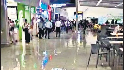 A videograb of a flooded food court at Terminal 1 of the Indira Gandhi International Airport after heavy rainfall, in New Delhi on Tuesday. (PTI) A videograb of a flooded food court at Terminal 1 of the Indira Gandhi International Airport after heavy rainfall, in New Delhi on Tuesday. (PTI)