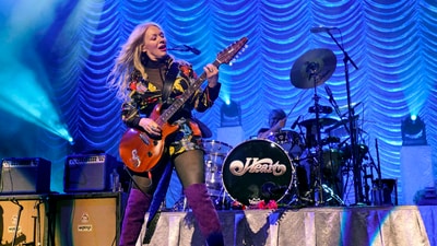 FILE - Nancy Wilson, of Heart, performs during the "Love Alive Tour" at the Hollywood Casino Amphitheatre on Thursday, July 11, 2019, in Chicago. (Photo by Rob Grabowski/Invision/AP, file) (Rob Grabowski/Invision/AP) FILE - Nancy Wilson, of Heart, performs during the "Love Alive Tour" at the Hollywood Casino Amphitheatre on Thursday, July 11, 2019, in Chicago. (Photo by Rob Grabowski/Invision/AP, file) (Rob Grabowski/Invision/AP)