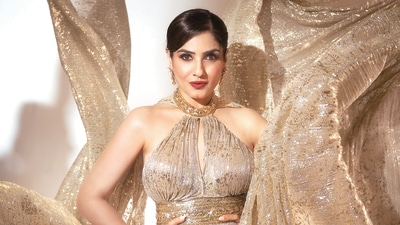 Raveena Tandon shimmers in a golden halter-neck dress with a long train from Suneet Varma. Her look is further spruced up by diamond earrings from Shailja’s Fine Jewellery (Photo: Deepak Das) Raveena Tandon shimmers in a golden halter-neck dress with a long train from Suneet Varma. Her look is further spruced up by diamond earrings from Shailja’s Fine Jewellery (Photo: Deepak Das)