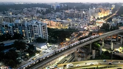 An aerial view shows the Namma Metro train of Bengaluru Metro Rail Corporation Limited (BMRCL), riding over a flyover in Bengaluru. (Pic for representation) (AFP) An aerial view shows the Namma Metro train of Bengaluru Metro Rail Corporation Limited (BMRCL), riding over a flyover in Bengaluru. (Pic for representation) (AFP)