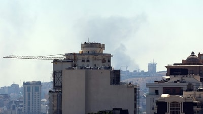 Smoke plumes arise from the Islamic Republic of Iran Broadcasting (IRIB) corporation building in the north of Tehran after it was hit by an overnight Israeli strike on June 17, 2025. (AFP) Smoke plumes arise from the Islamic Republic of Iran Broadcasting (IRIB) corporation building in the north of Tehran after it was hit by an overnight Israeli strike on June 17, 2025. (AFP)