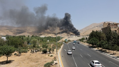 Smoke rises following what Iran says was an Israeli attack on Sharan Oil depot in Tehran. (Reuters)