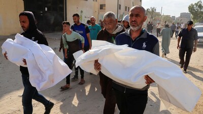 Mourners carry the bodies of Palestinians killed in what the Gaza Health Ministry said were Israeli strikes, in Khan Younis, southern Gaza Strip. (REUTERS)