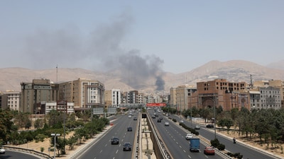 Smoke rises following what Iran says was an Israeli attack on Sharan Oil depot in Tehran. (Reuters)