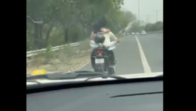 Noida Police fined a couple ₹53,500 after a viral video showed them engaging in PDA on a speeding bike, ignoring all safety rules. (X/@LalitBhati73) Noida Police fined a couple ₹53,500 after a viral video showed them engaging in PDA on a speeding bike, ignoring all safety rules. (X/@LalitBhati73)