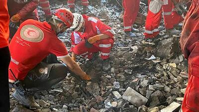 This handout picture released by the Iranian Red Crescent on June 17, 2025 shows members of their rescue teams searching the debris inside a building in Tehran, targeted by Israeli strikes. Israel and Iran exchanged missile fire for a fifth consecutive day on June 17, with the Israeli military saying in a statement it targeted multiple missile and drone sites in west Iran, including infrastructure, launchers and storage facilities. (AFP) This handout picture released by the Iranian Red Crescent on June 17, 2025 shows members of their rescue teams searching the debris inside a building in Tehran, targeted by Israeli strikes. Israel and Iran exchanged missile fire for a fifth consecutive day on June 17, with the Israeli military saying in a statement it targeted multiple missile and drone sites in west Iran, including infrastructure, launchers and storage facilities. (AFP)