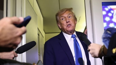 U.S. President Donald Trump speaks to reporters aboard Air Force One after departing early from the G7 summit in Canada to return to Washington, on June 17, 2025. (REUTERS)