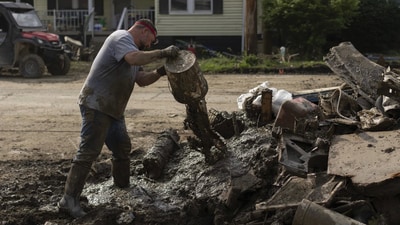 Heavy rains on Sunday tore off the outside wall of an apartment complex and damaged roads and bridges in the Marion County community of Fairmont. There were no reported injuries. (AP)