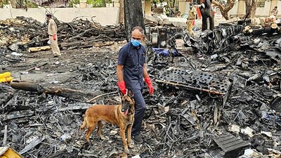 SDRF and Police personnel conduct a search operation at the Air India AI-171 flight crash site (@dgpgujarat X)