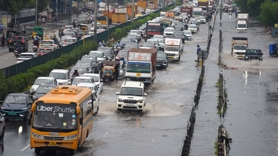 Vehicles wade through a waterlogged stretch after heavy rain on the National Highway-48 service road near Narsinghpur village, in Gurugram (Parveen Kumar/Hindustan Times) Vehicles wade through a waterlogged stretch after heavy rain on the National Highway-48 service road near Narsinghpur village, in Gurugram (Parveen Kumar/Hindustan Times)