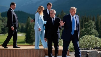 Japanese Prime Minister Shigeru Ishiba, Italian Prime Minister Giorgia Meloni, French President Emmanuel Macron, Canadian Prime Minister Mark Carney, and U.S. President Donald Trump depart following a group photo in front of the Canadian Rockies at the Kananaskis Country Golf Course during the G7 Leaders' Summit on June 16, 2025 in Kananaskis, Alberta. (AFP)