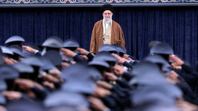 Iran's Supreme Leader Ayatollah Ali Khamenei listens to the national anthem as Air Force officers salute during their meeting in Tehran, Iran (REUTERS/File)