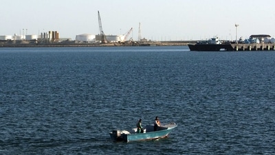 A speed boat passes by oil docks at the port of Kalantari in the city of Chabahar, east of the Strait of Hormuz. (Reuters File)