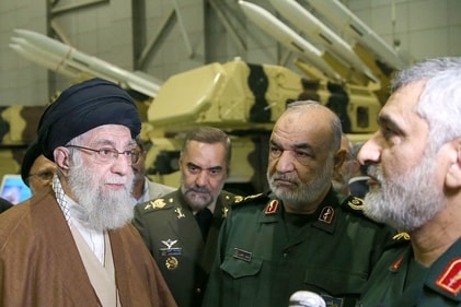 (FILES) This handout file picture obtained from the office of Iran's Supreme Leader Ayatollah Ali Khamenei shows him (L), Hossein Salami (2nd R), head of Iran's Islamic Revolutionary Guard Corps (IRGC), and General Amir Ali Hajizadeh, the head of the corps' aerospace division (R) (AFP)