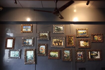 One of the walls of the heritage home features photos of the iconic spots around Mumbai that the owners feel is a must visit for travellers (HT photos )