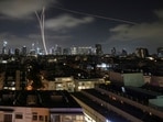 Israeli air defense system fires to intercept missiles during an Iranian attack over Tel Aviv, Israel, early Wednesday, June 18, 2025. 