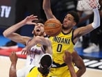 Chet Holmgren #7 of the Oklahoma City Thunder and Tyrese Haliburton #0 of the Indiana Pacers