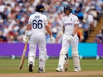 England's Ben Stokes with Joe Root during a Test against West Indies last year