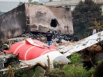 A fire officer stands next to the crashed Air India Boeing 787-8 Dreamliner aircraft, in Ahmedabad, India, June 13, 2025. 