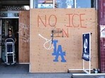 A business remains partially boarded up with a message reading "No ICE In LA" on the day the overnight curfew was lifted in downtown on June 17, 2025 in Los Angeles, California. A business remains partially boarded up with a message reading "No ICE In LA" on the day the overnight curfew was lifted in downtown on June 17, 2025 in Los Angeles, California.