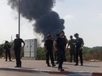 Iran Israel war news Highlights: Israeli police officers near smoke from an Iranian missile strike in Hertzliya, Israel, where Iran allegedly struck Mossad's centre.