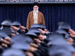 Iran's Supreme Leader Ayatollah Ali Khamenei listens to the national anthem as Air Force officers salute during their meeting in Tehran, Iran.