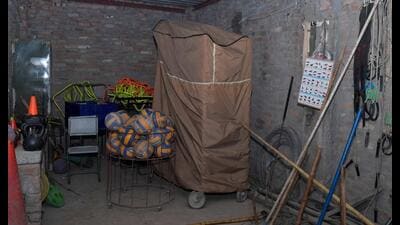 A volleyball pitching machine lying unused for want of indoor stadium in Ludhiana’s SCD Government College. (Manish/HT)